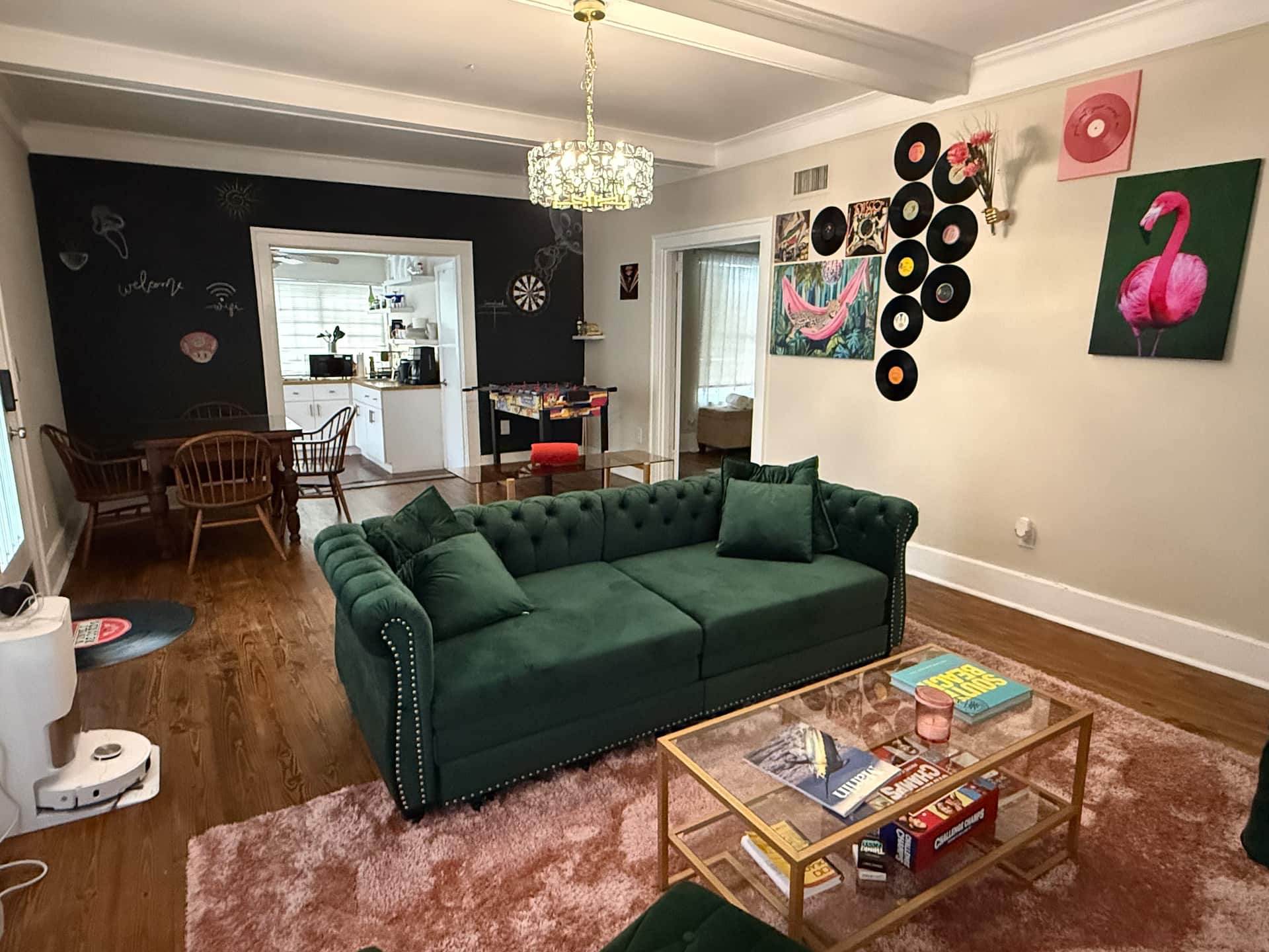 Eclectic living room with a green velvet sofa and art